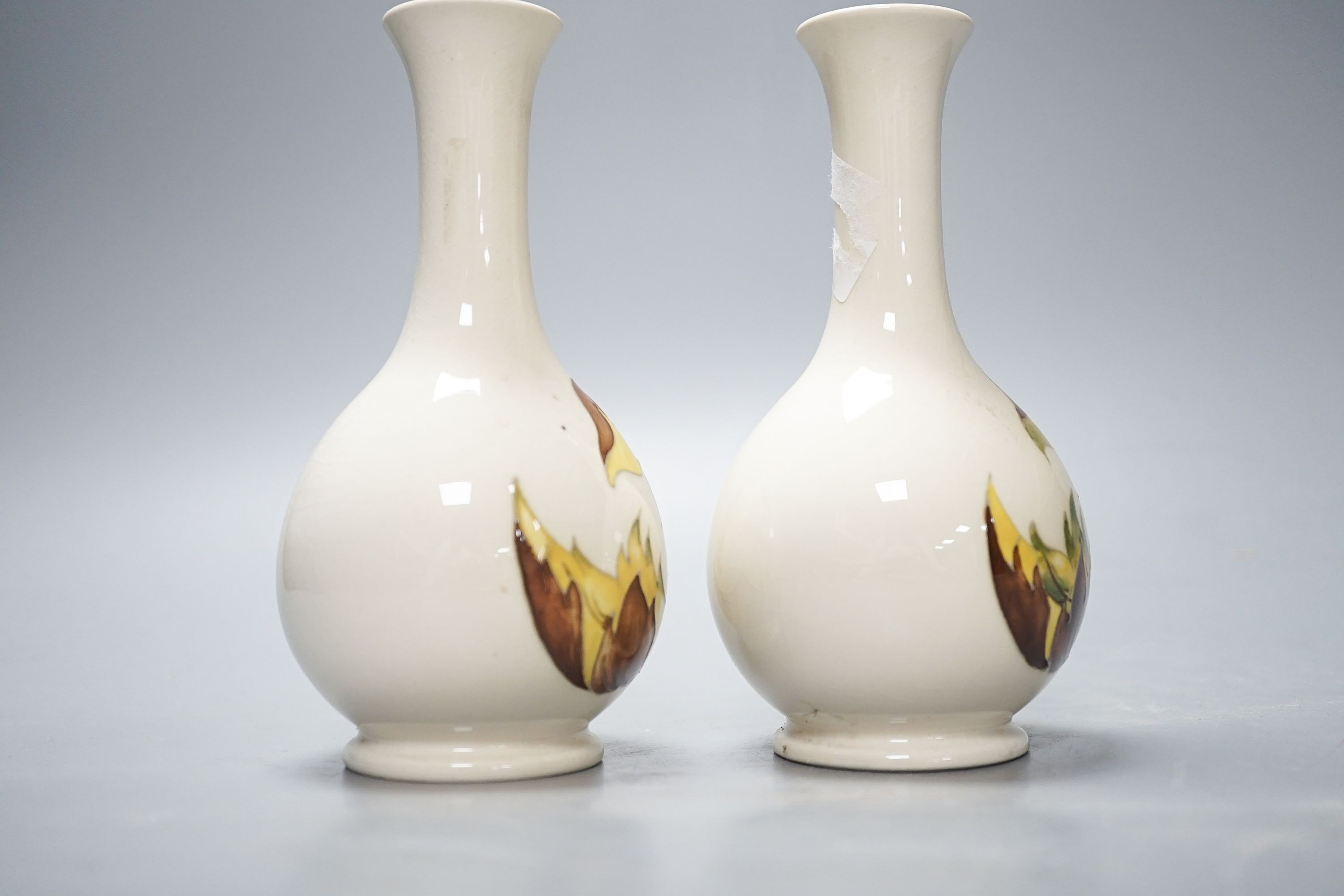 A pair of Moorcroft ‘leaves in the wind’ vases 15.5cm